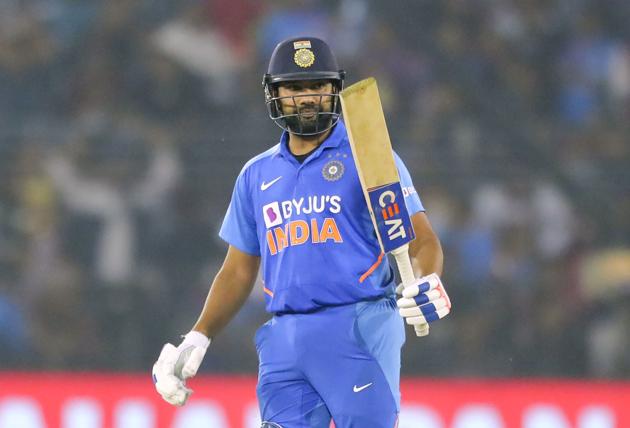 India's Rohit Sharma raises his bat to celebrate scoring fifty runs during the third and final one-day international cricket match of the series between India and West Indies in Cuttack, India, Sunday, Dec. 22, 2019. (AP Photo/Mahesh Kumar A.)(AP)