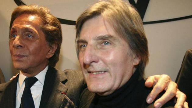 FILE - In this Wednesday, Jan. 23, 2008 file photo, Italian fashion designer Valentino, left, celebrates with French designer Emmanuel Ungaro after the presentation of his Haute Couture Spring-Summer 2008 collection, in Paris. Fashion house Emanuel Ungaro says that French designer Emanuel Ungaro has died at the age of 86. The house posted Sunday, Dec. 22, 2019 on Instagram that Ungaro “will remain in our memories as the Master of sensuality, of color and flamboyance." Ungaro has died on Saturday in Paris, according to French medias. Renowned for his use of vibrant colors, mixed prints and elegant draping, Ungaro founded the house that bears his name in 1965. He retired from fashion in 2004. (AP Photo/Thibault Camus, File)(AP)