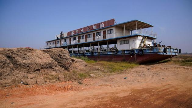 A boat rests on the dried lake bed of Poyang Lake. The new policy was a sign officials had recognised sand mining had become a serious environmental liability, Shankman said, but simply stopping the activity wouldn’t automatically solve the problems. “It depends not only on the extent of the mining, and not on the total area of the mining, but where they are mining,” Shankman said. (Aly Song / REUTERS) A boat rests on the dried lake bed of Poyang Lake. The new policy was a sign officials had recognised sand mining had become a serious environmental liability, Shankman said, but simply stopping the activity wouldn’t automatically solve the problems. “It depends not only on the extent of the mining, and not on the total area of the mining, but where they are mining,” Shankman said. (Aly Song / REUTERS)