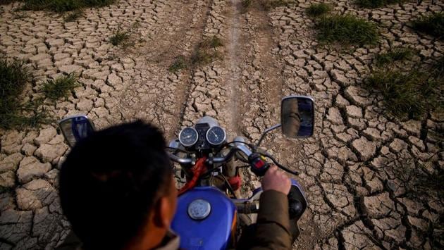 A fisherman rides a motorcycle across the dried lake bed. China is in the middle of a campaign aimed at ending big and “destructive” development along the Yangtze. President Xi said restoring the Poyang was a crucial element of the plan to revitalise regions along the river’s banks. But experts say many of the devastating changes to the lake are irreversible. (Aly Song / REUTERS) A fisherman rides a motorcycle across the dried lake bed. China is in the middle of a campaign aimed at ending big and “destructive” development along the Yangtze. President Xi said restoring the Poyang was a crucial element of the plan to revitalise regions along the river’s banks. But experts say many of the devastating changes to the lake are irreversible. (Aly Song / REUTERS)