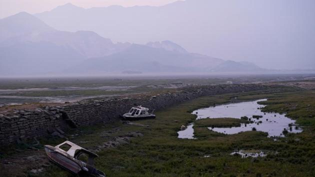 An abandoned boats lie on the dried lake bed of Poyang Lake, in Jiujiang, Jiangxi province, China. After wading through mudflats, Fan Xinde, a 36-year-old fisherman, sifts old copper coins from the debris scooped from the bed of a dwindling river that feeds China’s biggest freshwater lake, the Poyang. (Aly Song / REUTERS) An abandoned boats lie on the dried lake bed of Poyang Lake, in Jiujiang, Jiangxi province, China. After wading through mudflats, Fan Xinde, a 36-year-old fisherman, sifts old copper coins from the debris scooped from the bed of a dwindling river that feeds China’s biggest freshwater lake, the Poyang. (Aly Song / REUTERS)