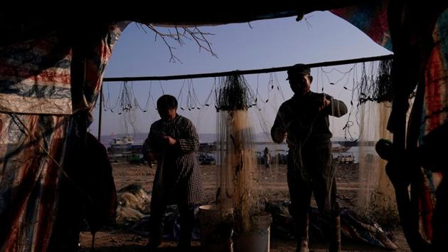 Fishermen remove fish from a net. “Our sources of income have been cut off. We don’t have anything else,” Fan said. “To be honest, we shouldn’t be collecting the coins at all because they are owned by the state, but it is only a tiny amount.” The government says excessive fishing has brought stocks down to perilously low levels and put endangered species under threat, including China’s last surviving river mammal, the Yangtze finless porpoise. (Aly Song / REUTERS) Fishermen remove fish from a net. “Our sources of income have been cut off. We don’t have anything else,” Fan said. “To be honest, we shouldn’t be collecting the coins at all because they are owned by the state, but it is only a tiny amount.” The government says excessive fishing has brought stocks down to perilously low levels and put endangered species under threat, including China’s last surviving river mammal, the Yangtze finless porpoise. (Aly Song / REUTERS)