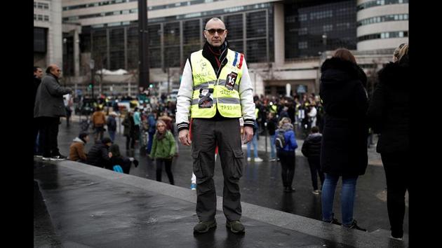 Protester Didier Baylac wears a yellow vest during the 56th round of protests, with a backdrop of social discontentment triggered by president Macron’s pension reform plan in Paris, France. “All the powerful, all the rich, want us to believe we live in a wonderful world, that we are protected, we do not need to worry about anything. All this is untrue: it is only the case for the rich people who are protected ... all the other honest small people struggle.” (Benoit Tessier / REUTERS) Protester Didier Baylac wears a yellow vest during the 56th round of protests, with a backdrop of social discontentment triggered by president Macron’s pension reform plan in Paris, France. “All the powerful, all the rich, want us to believe we live in a wonderful world, that we are protected, we do not need to worry about anything. All this is untrue: it is only the case for the rich people who are protected ... all the other honest small people struggle.” (Benoit Tessier / REUTERS)