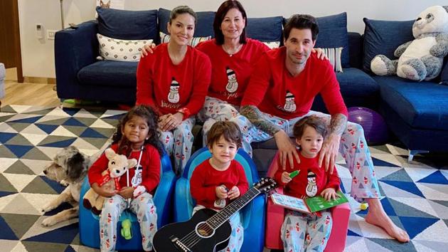 Sunny Leone poses for a family Christmas photo.