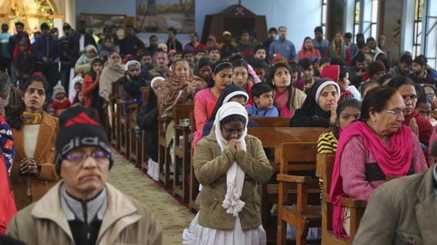 People offer prayers at Saint Mary's Garrison church on the occasion of Christmas in Jammu, Jammu and Kashmir. (Channi Anand / AP) People offer prayers at Saint Mary's Garrison church on the occasion of Christmas in Jammu, Jammu and Kashmir. (Channi Anand / AP)