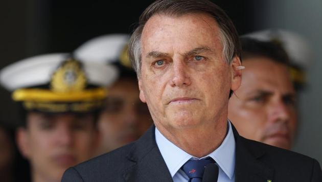 Brazil's President Jair Bolsonaro attends a military ceremony in honor of Sailor Day, in Brazil. Bolsonaro left the hospital on December 24 after a fall in the presidential residence. (AP) Brazil's President Jair Bolsonaro attends a military ceremony in honor of Sailor Day, in Brazil. Bolsonaro left the hospital on December 24 after a fall in the presidential residence. (AP)