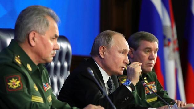 Russian President Vladimir Putin, center, gestures while speaking during an annual meeting with top military officials in the National Defense Control Center in Moscow, Russia. (AP) Russian President Vladimir Putin, center, gestures while speaking during an annual meeting with top military officials in the National Defense Control Center in Moscow, Russia. (AP)