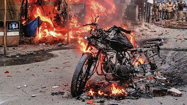 A vehicle torched allegedly by protestors during a demonstration against the Citizenship Amendment Act.(PTI Photo)