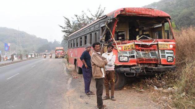 Nine schoolchildren, two teachers and one helper were travelling in the bus. (In pic) The mangled remains of the state transport bus after it collided with a tractor on Pune-Mumbai Highway.(HT/PHOTO)