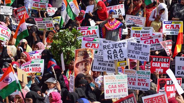 Members of Women India Movement display placards and raise slogans during a protest against the Citizenship (Amendment) Act (CAA), National Register of Citizenship (NRC) and National Population Register (NPR), in Bengaluru, December 26(PTI)
