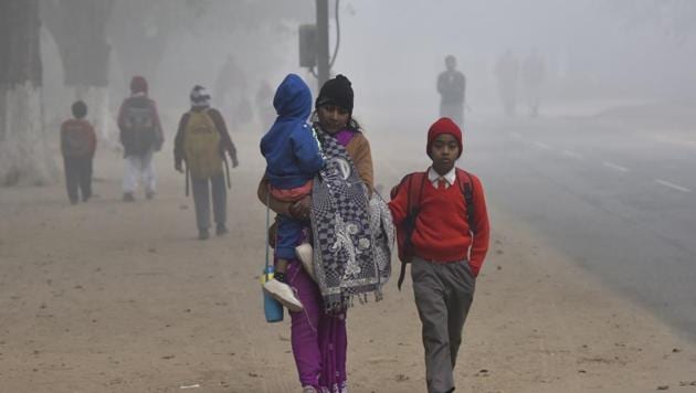 Students on a way to school during a cold and foggy morning(HT File) Students on a way to school during a cold and foggy morning(HT File)