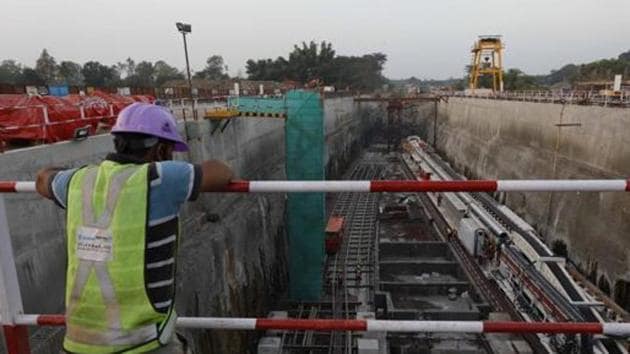 Maha-Metro, which is executing the Pune Metro rail project, has ordered an inquiry into the death of an employee working on its site on Tuesday, after the individual lost his balance and was run over by a Hydra road crane .(HT FILE)