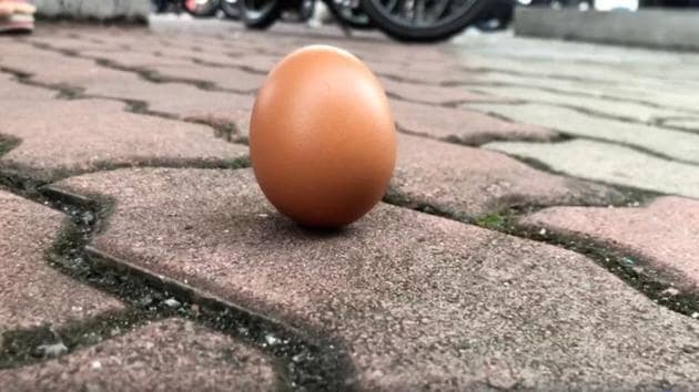 An egg is seen on the ground in Kuala Lumpur, Malaysia on December 26, 2019 in this screen grab obtained from a social media video.(HAKEEM MAAROF via REUTERS) An egg is seen on the ground in Kuala Lumpur, Malaysia on December 26, 2019 in this screen grab obtained from a social media video.(HAKEEM MAAROF via REUTERS)