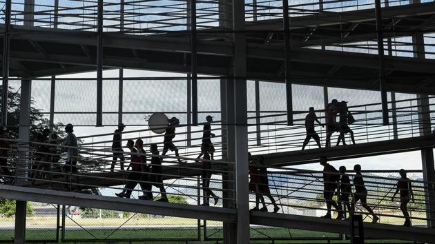 Red Demons walk up the grandstands at Estadio Metropolitano before a match between their team and Deportivo Lara in Cabudare. To promote soccer, the group organises sports workshops, cultural events and offer hot food in poor neighbourhoods of Caracas. (Matias Delacroix / AP)