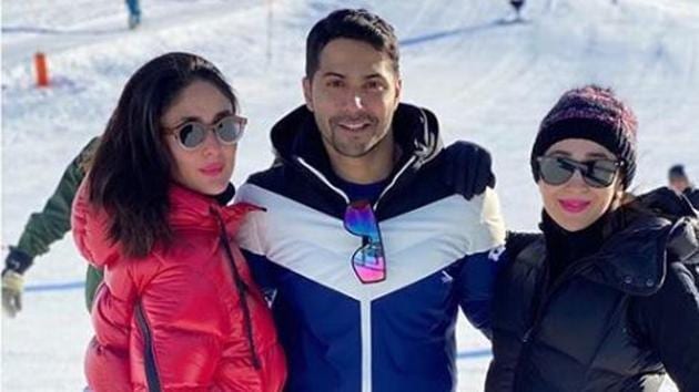 Kareena Kapoor, Karisma Kapoor, and Varun Dhawan pose together in Switzerland.