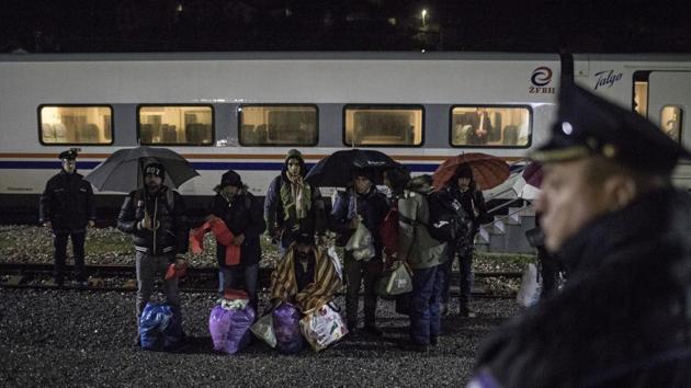 A group of migrants stand by the rail tracks after being taken off a train bound to the town of Bihac by Bosnian police in Bosanska Krupa, northwestern Bosnia. The migrants have to go over a mountain pass and police often turn them back. They call it the “Game” — a cat-and-mouse chase with Croatia’s border patrols over the mountain tracks. Sometimes migrants try several times before they manage to cross; sometimes it takes weeks, even months. (Manu Brabo / AP) A group of migrants stand by the rail tracks after being taken off a train bound to the town of Bihac by Bosnian police in Bosanska Krupa, northwestern Bosnia. The migrants have to go over a mountain pass and police often turn them back. They call it the “Game” — a cat-and-mouse chase with Croatia’s border patrols over the mountain tracks. Sometimes migrants try several times before they manage to cross; sometimes it takes weeks, even months. (Manu Brabo / AP)
