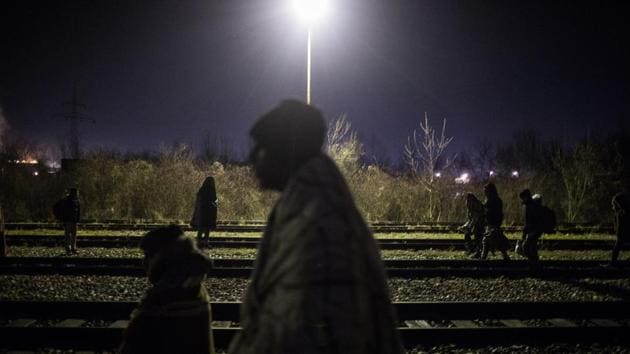 A group of migrants wander around the rail tracks near the river Drina bordering between Bosnia and Serbia in the town of Karakaj. Bosnian authorities say there are several thousand people from the Middle East, Africa and Asia who are staying in the country while on their way toward wealthy EU nations. Bosnia’s border police say they don’t have enough manpower to stop the flow — the impoverished country is struggling to accommodate the newcomers. (Manu Brabo / AP) A group of migrants wander around the rail tracks near the river Drina bordering between Bosnia and Serbia in the town of Karakaj. Bosnian authorities say there are several thousand people from the Middle East, Africa and Asia who are staying in the country while on their way toward wealthy EU nations. Bosnia’s border police say they don’t have enough manpower to stop the flow — the impoverished country is struggling to accommodate the newcomers. (Manu Brabo / AP)