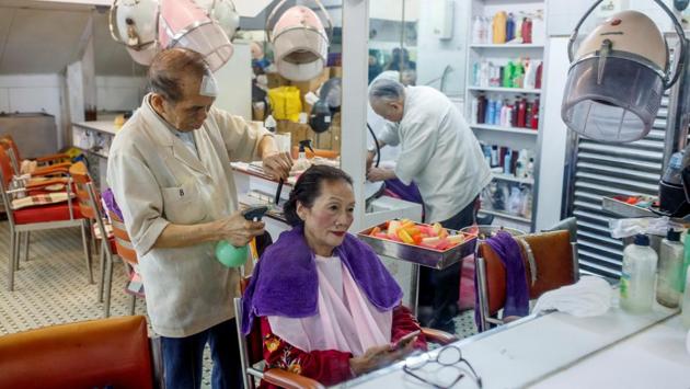 A woman has her hair done at the Great Chinese Barbershop, which has not changed in more than half a century according to one of its co-owners, at North Point. The newly elected councillors have formed a liberal alliance to capitalise on their gains and give political heft to the calls on the streets for democratic reforms in Hong Kong. (Thomas Peter / REUTERS) A woman has her hair done at the Great Chinese Barbershop, which has not changed in more than half a century according to one of its co-owners, at North Point. The newly elected councillors have formed a liberal alliance to capitalise on their gains and give political heft to the calls on the streets for democratic reforms in Hong Kong. (Thomas Peter / REUTERS)