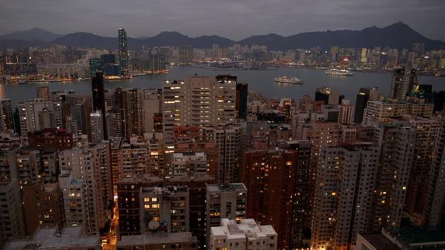 Lit-up buildings stand within the North Point and Fortress Hill district in Hong Kong. Once officially installed on Jan. 1, they plan to hold community “democracy forums”, lobby for rent ceilings in government apartments, and question police about alleged brutality in dealing with protesters and their response to dealing with the attacks by pro-Beijing supporters. The police have defended their actions as being necessary to break up protests that have often become violent. (Thomas Peter / REUTERS) Lit-up buildings stand within the North Point and Fortress Hill district in Hong Kong. Once officially installed on Jan. 1, they plan to hold community “democracy forums”, lobby for rent ceilings in government apartments, and question police about alleged brutality in dealing with protesters and their response to dealing with the attacks by pro-Beijing supporters. The police have defended their actions as being necessary to break up protests that have often become violent. (Thomas Peter / REUTERS)