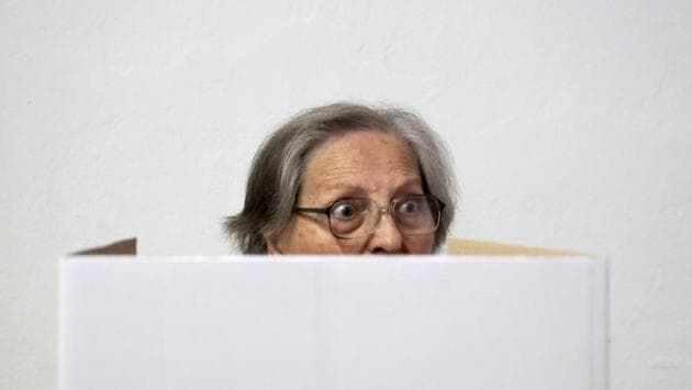 A woman casts her ballot at a polling station during the presidential election in Zagreb, Croatia. (Marko Djurica / REUTERS) A woman casts her ballot at a polling station during the presidential election in Zagreb, Croatia. (Marko Djurica / REUTERS)