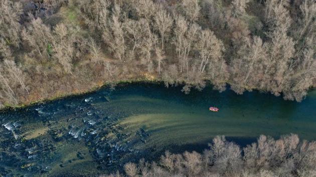 An aerial view of people rafting on Nestos river near the northern Greek city of Drama. (Aris Messinis / AFP) An aerial view of people rafting on Nestos river near the northern Greek city of Drama. (Aris Messinis / AFP)