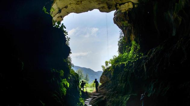 Visitors stand in front of a cave in Lhoong, Aceh province, Indonesia. The cave is believed to be about 7,400 years old and holds deposits of previous tsunamis. (Chaideer Mahyuddin / AFP) Visitors stand in front of a cave in Lhoong, Aceh province, Indonesia. The cave is believed to be about 7,400 years old and holds deposits of previous tsunamis. (Chaideer Mahyuddin / AFP)