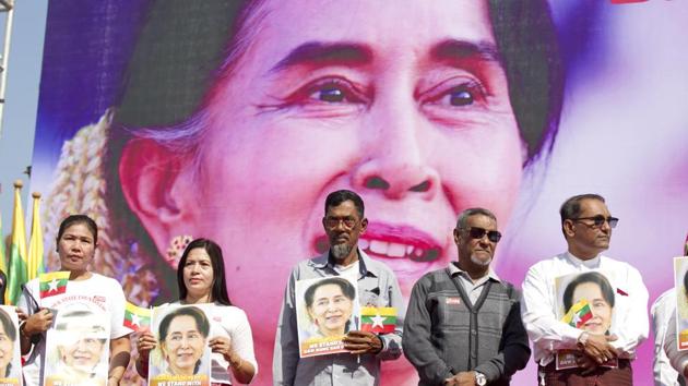 In this Tuesday, Dec. 10, 2019 file photo, Members of Myanmar Muslims community hold portraits of Myanmar leader Aung San Suu Kyi to pray as they gather in front of City Hall in Yangon, Myanmar.(AP) In this Tuesday, Dec. 10, 2019 file photo, Members of Myanmar Muslims community hold portraits of Myanmar leader Aung San Suu Kyi to pray as they gather in front of City Hall in Yangon, Myanmar.(AP)