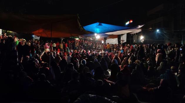 People listen to a speaker during a sit-in protest against the Citizenship Amendment Act (CAA), National Register of Citizens (NRC) and National Population Register (NPR) at Shaheen Bagh, Jamia Nagar, in New Delhi. Protesters have been camping round-the-clock at Shaheen Bagh since December 15. (Hardeep Singh / HT Photo)
