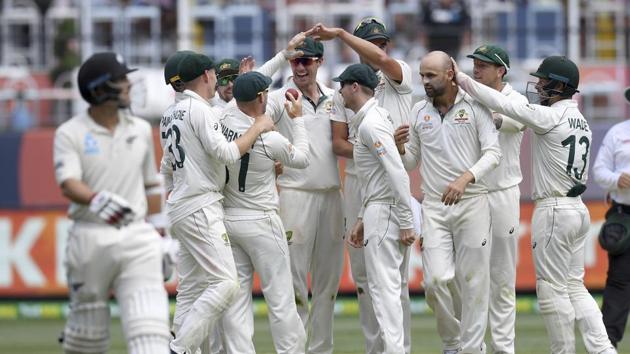 Australian players celebrate the wicket of New Zealand's Colin de Grandhomme, left, during play in their cricket test match in Melbourne, Australia, Sunday, Dec. 29, 2019.(AP) Australian players celebrate the wicket of New Zealand's Colin de Grandhomme, left, during play in their cricket test match in Melbourne, Australia, Sunday, Dec. 29, 2019.(AP)