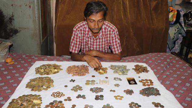 Numismatist Prakash Gohil with his collection of coins, in Kalyan, Maharashtra. Gohil hails from Maharashtra’s Ambernath and has been collecting coins for the last 30 years. He is now documenting his collection. (Rishikesh Choudhary / HT Photo)