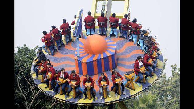 Children on an amusement park ride, at The Great India Place Mall, Sector 38A, in Noida. (Sunil Ghosh / HT Photo)