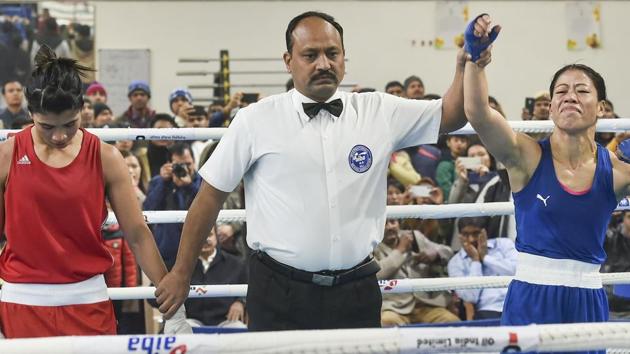 Referee raises the hand of boxer Mary Kom after her bout against Nikhat Zareen.(PTI) Referee raises the hand of boxer Mary Kom after her bout against Nikhat Zareen.(PTI)