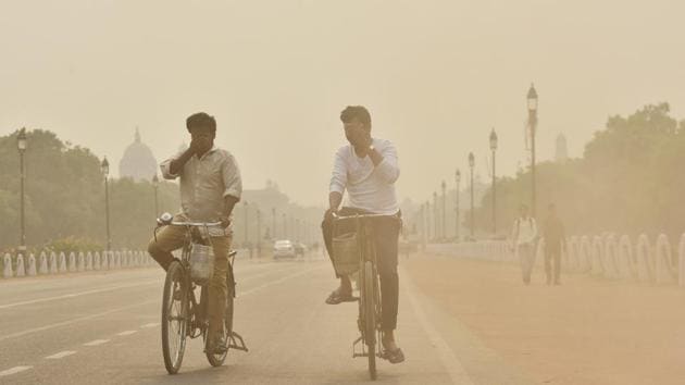 Men ride their bicycles amid dust and haze at Rajpath in New Delhi on May 13. Delhi became the most polluted major city in the world with an air quality index (AQI) of 527, as per data by Air Visual on the World AQI rankings. Delhi air quality broke all records on November 5, when it was in the hazardous range for nine consecutive days, making this the longest spell of hazardous air quality since public records began. (Sanjeev Verma/HT Photo) Men ride their bicycles amid dust and haze at Rajpath in New Delhi on May 13. Delhi became the most polluted major city in the world with an air quality index (AQI) of 527, as per data by Air Visual on the World AQI rankings. Delhi air quality broke all records on November 5, when it was in the hazardous range for nine consecutive days, making this the longest spell of hazardous air quality since public records began. (Sanjeev Verma/HT Photo)
