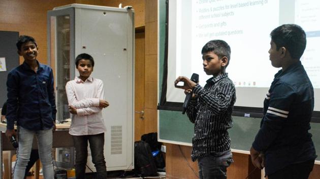 Team members of Gamecation startup from Municipal corporation school explaining their startup ideas at IISER, Pashan.(Milind Saurkar/HT Photo)