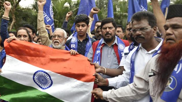 Union Minister Ramdas Athawale and his party workers gather for support of CAA outside the collecter office, Bandra in Mumbai December 29, 2019. (Satish Bate/HT Photo) Union Minister Ramdas Athawale and his party workers gather for support of CAA outside the collecter office, Bandra in Mumbai December 29, 2019. (Satish Bate/HT Photo)