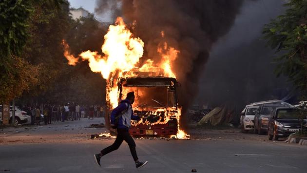 A burning bus is seen after it was set on fire during a protest against Citizenship Amendment Act (CAA) at New Friends Colony in New Delhi on December 15. Incidents of violence and police action against students were seen at Jamia Millia Islamia and Aligarh Muslim University. Nationwide protests erupted in support of the students and in expression of mistrust in the NRC and CAA. (Sanjeev Verma/HT Photo) A burning bus is seen after it was set on fire during a protest against Citizenship Amendment Act (CAA) at New Friends Colony in New Delhi on December 15. Incidents of violence and police action against students were seen at Jamia Millia Islamia and Aligarh Muslim University. Nationwide protests erupted in support of the students and in expression of mistrust in the NRC and CAA. (Sanjeev Verma/HT Photo)