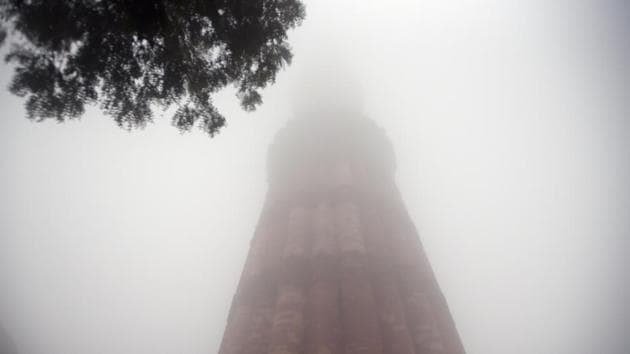 Qutub Minar engulfed in dense fog cover is seen on a cold winter day at Mehrauli. On Saturday, the India Meteorological Department (IMD) had issued a ‘red’ warning for the national capital as cold wave conditions continued unabated in the region. The red colour denotes extreme weather conditions. (Amal KS / HT Photo) Qutub Minar engulfed in dense fog cover is seen on a cold winter day at Mehrauli. On Saturday, the India Meteorological Department (IMD) had issued a ‘red’ warning for the national capital as cold wave conditions continued unabated in the region. The red colour denotes extreme weather conditions. (Amal KS / HT Photo)