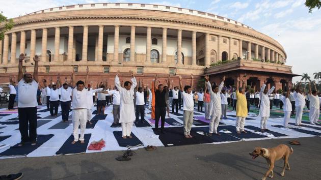Members of Parliament and other officials perform yoga on the occasion of International Yoga Day at Parliament House in New Delhi on June 21. (Sonu Mehta/HT Photo) Members of Parliament and other officials perform yoga on the occasion of International Yoga Day at Parliament House in New Delhi on June 21. (Sonu Mehta/HT Photo)