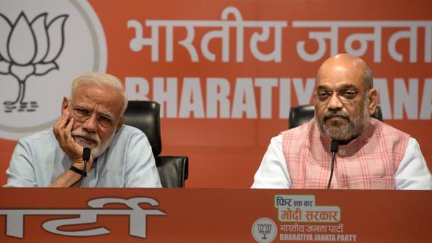 Prime Minister Narendra Modi and Bharatiya Janata Party (BJP) President Amit Shah during a press conference at BJP headquarters in New Delhi on May 17. The event was PM’s only press conference during the first tenure of his government and he avoided answering any questions directed to him. (Mohd Zakir/HT Photo) Prime Minister Narendra Modi and Bharatiya Janata Party (BJP) President Amit Shah during a press conference at BJP headquarters in New Delhi on May 17. The event was PM’s only press conference during the first tenure of his government and he avoided answering any questions directed to him. (Mohd Zakir/HT Photo)