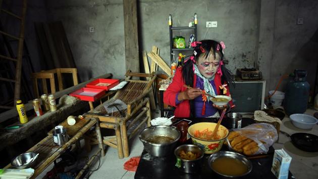 Liu Peilin eats breakfast at her house at AnotherCommunity. The community also serves as a safe space for 63-year-old transgender woman Liu, who has known Tang for several years. (Tingshu Wang / REUTERS)