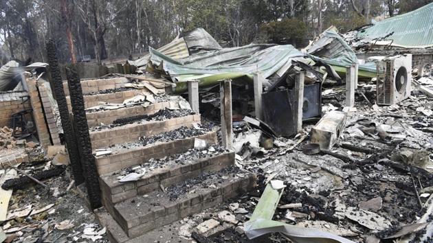 A burnt-out residence is seen in Sarsfield, East Gippsland, Victoria. In Mallacoota, smoke turned day to night and the authorities said nearby fires were causing extreme thunderstorms and ’ember attacks’. (James Ross/AP) A burnt-out residence is seen in Sarsfield, East Gippsland, Victoria. In Mallacoota, smoke turned day to night and the authorities said nearby fires were causing extreme thunderstorms and ’ember attacks’. (James Ross/AP)