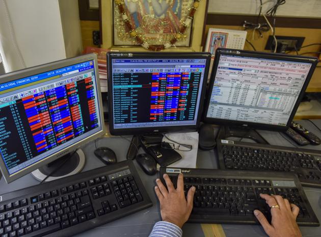 A stockbroker trades shares on a terminal as the benchmark share index SENSEX crosses 32,000 points at a brokerage house in Mumbai. (Kunal Patil/HT Photo) A stockbroker trades shares on a terminal as the benchmark share index SENSEX crosses 32,000 points at a brokerage house in Mumbai. (Kunal Patil/HT Photo)