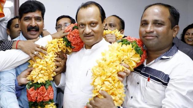 Deputy Chief Minister of Maharashtra Ajit Pawar being garlanded after the swearing-in ceremony, in Mumbai on Monday.(ANI PHOTO)