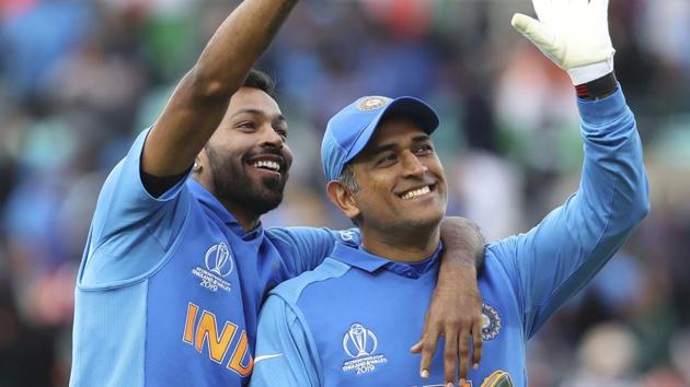 India's MS Dhoni, right, and Hardik Pandya wave towards a gallery.(AP)