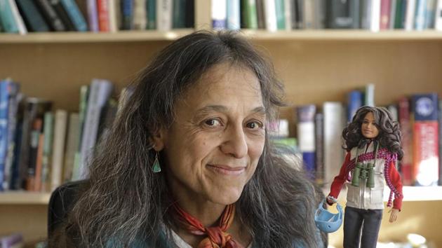 Ecologist Nalini Nadkarni is shown in her lab on the University of Utah campus in Salt Lake City holding a Barbie created to look like her when she's climbing into the treetops to study the rainforest canopy.(AP) Ecologist Nalini Nadkarni is shown in her lab on the University of Utah campus in Salt Lake City holding a Barbie created to look like her when she's climbing into the treetops to study the rainforest canopy.(AP)