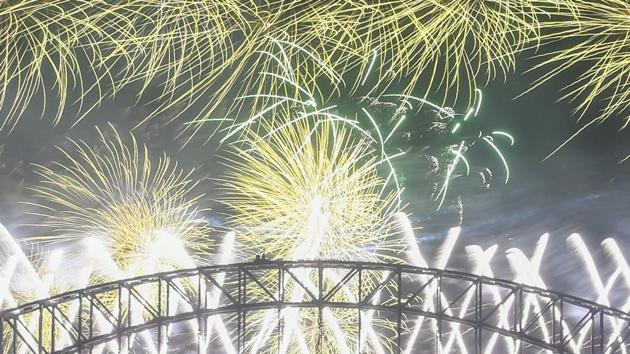 Midnight fireworks explode over the Sydney Harbour Bridge during New Year's eve celebrations in Sydney, Tuesday, Dec.31, 2019. (Lukas Coch/AAP Images via AP) (AP) 