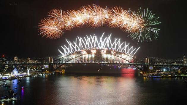Midnight fireworks explode over the Sydney Harbour Bridge during New Year's eve celebrations in Sydney, Tuesday, Jan.1, 2019. (Lukas Coch/AAP Images via AP) (AP) 
