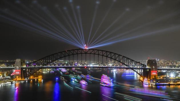A long exposure image shows ships passing under the Sydney Harbour Bridge on Sydney Harbour at the end of the Year's Eve celebrations in Sydney, Australia, December 31, 2019. AAP Image for City of Sydney/Lukas Coch/via REUTERS (REUTERS) 