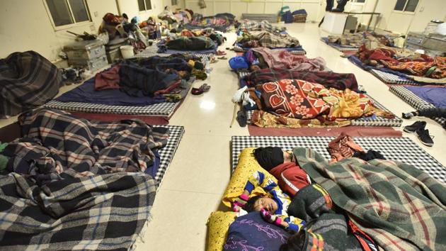 People asleep in a night shelter at Sarai Kale Khan. Indu Prakash Singh, member of the Supreme Court-appointed state-level shelter monitoring committee for Delhi, said the number of shelters are not enough. “I had earlier reported to the court that the count of homeless in Delhi was around 1, 60,000. As per the Delhi Master Plan, the shelters must have a total area of around 18 lakh square feet. But what we have is just around 3 lakh square feet, which is not even half of what is required,” said Singh. (Sanjeev Verma/HT Photo) People asleep in a night shelter at Sarai Kale Khan. Indu Prakash Singh, member of the Supreme Court-appointed state-level shelter monitoring committee for Delhi, said the number of shelters are not enough. “I had earlier reported to the court that the count of homeless in Delhi was around 1, 60,000. As per the Delhi Master Plan, the shelters must have a total area of around 18 lakh square feet. But what we have is just around 3 lakh square feet, which is not even half of what is required,” said Singh. (Sanjeev Verma/HT Photo)
