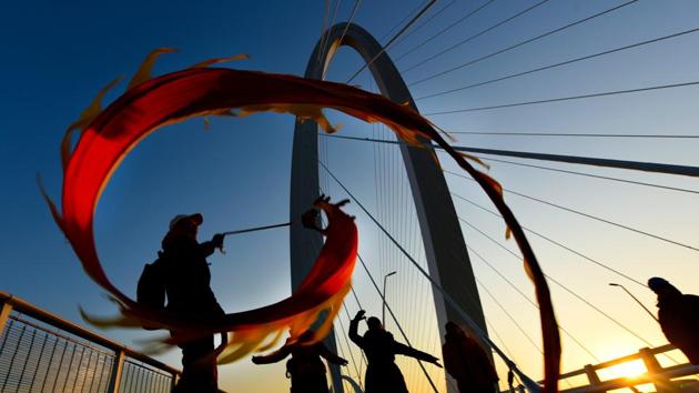People perform dragon dance to mark the New Year on Shougang Bridge in Beijing, China. (China Daily via REUTERS) People perform dragon dance to mark the New Year on Shougang Bridge in Beijing, China. (China Daily via REUTERS)